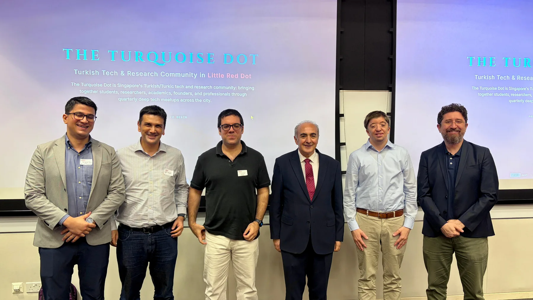 Speakers and organisers with H.E. Sadık Arslan, Ambassador of Türkiye to Singapore, in front of The Turquoise Dot title slide